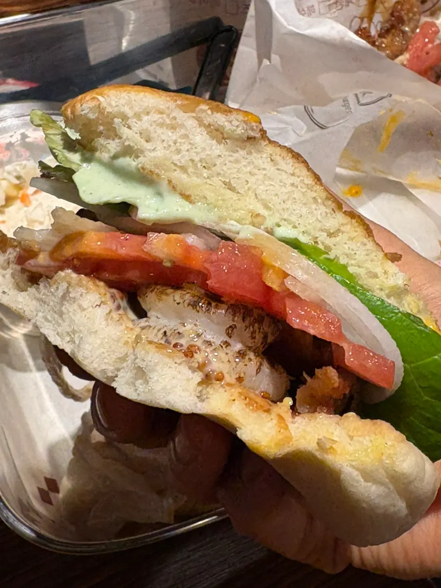 Inside the shrimp burger with whole shrimp and fried onions