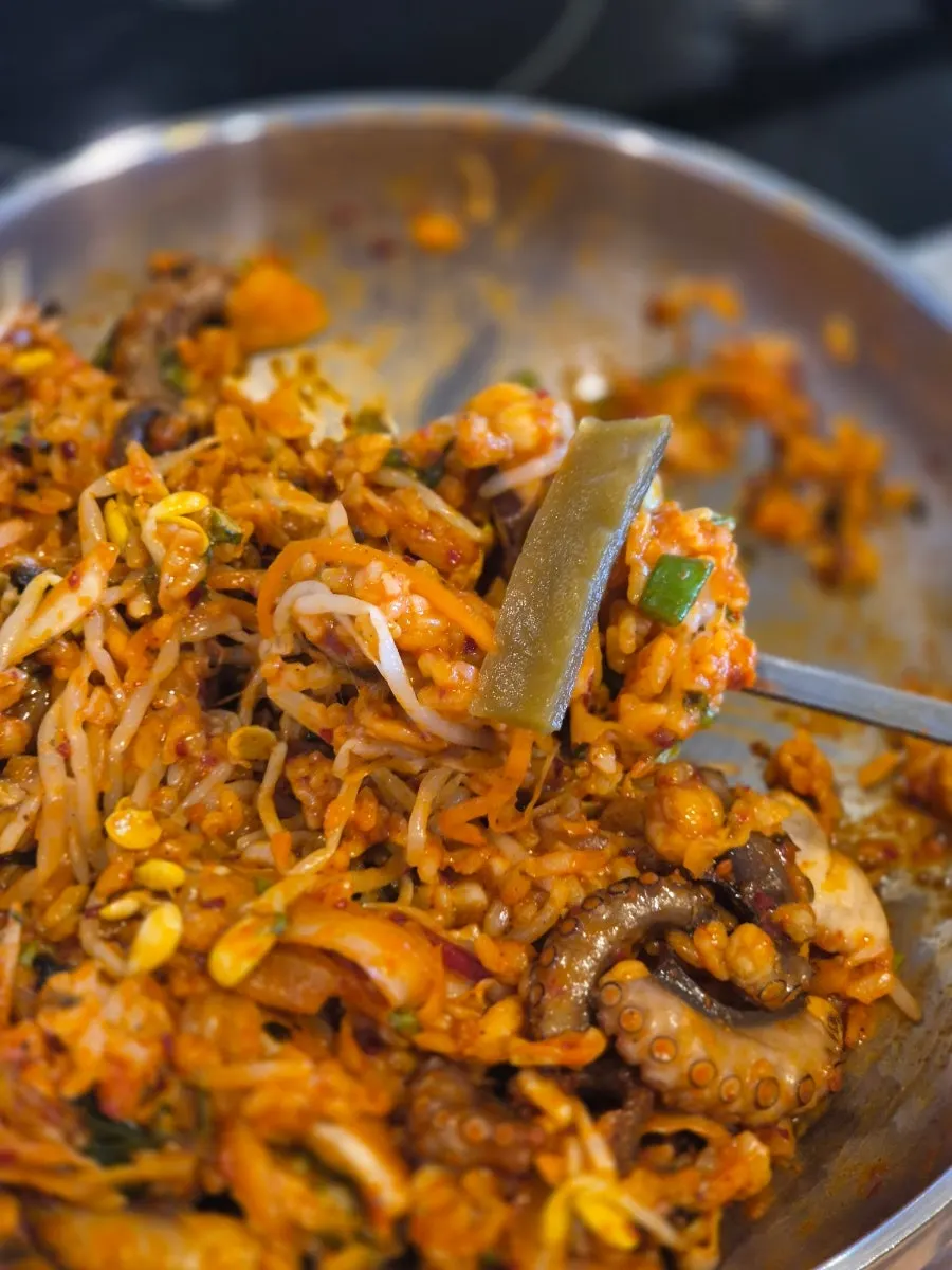 Spicy octopus stir-fry enjoyed with side dishes