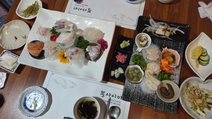Wide shot of the aged sashimi course spread at Ppong Sashimi