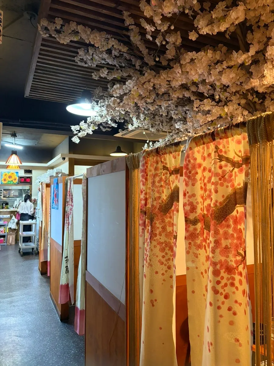 Celebrity autographs displayed inside Ppong Sashimi