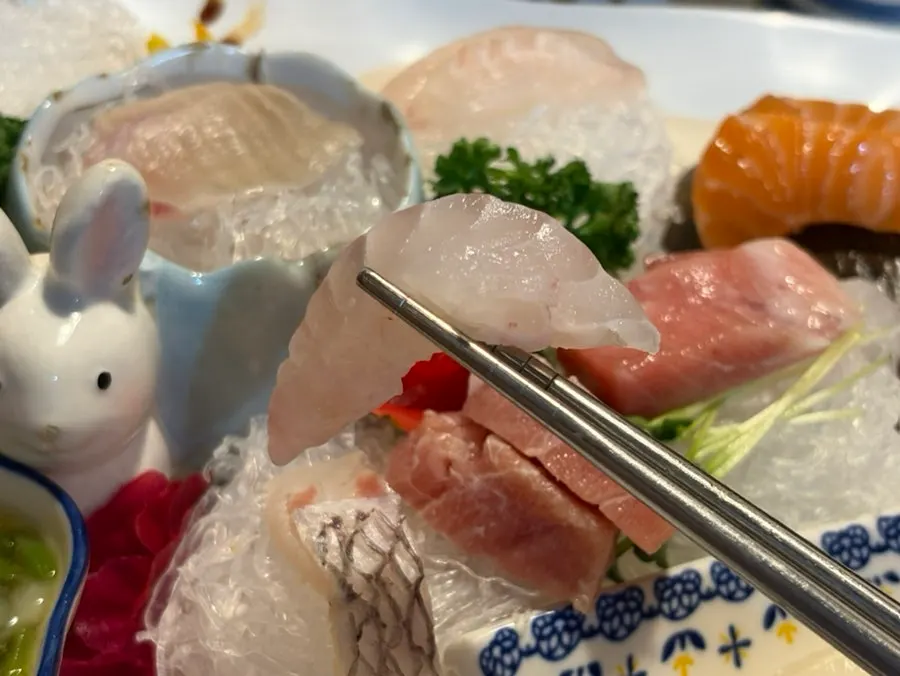 Table laid out with mixed sashimi