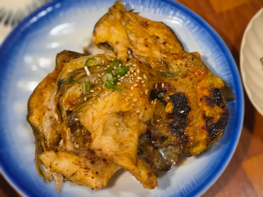 Cheese-topped grilled abalone, shrimp, and clams
