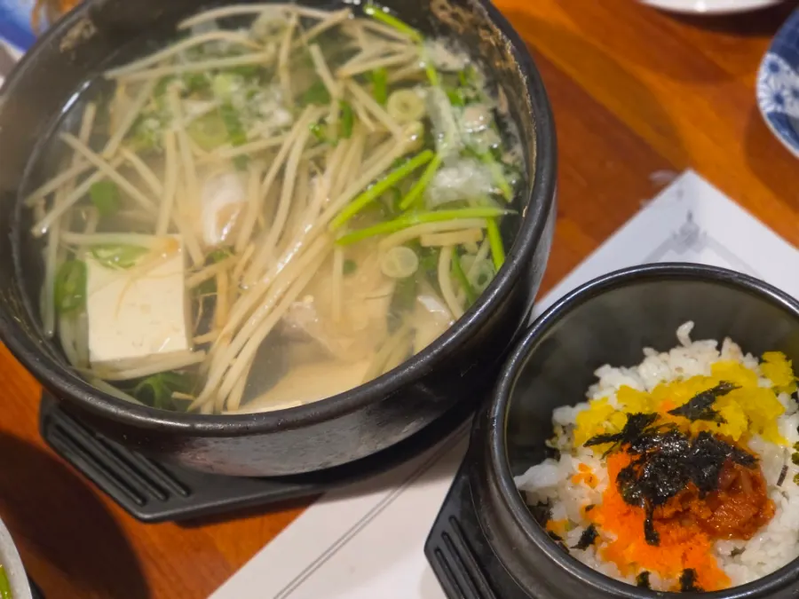 Soy-sauce-based Japanese soup with meat, tofu, and vegetables