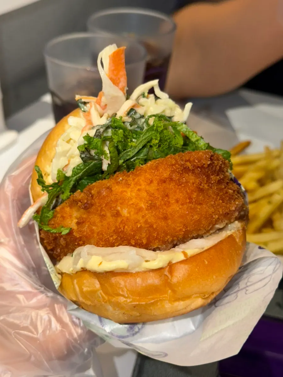 Big Wasabi Shrimp Burger half-wrapped in paper