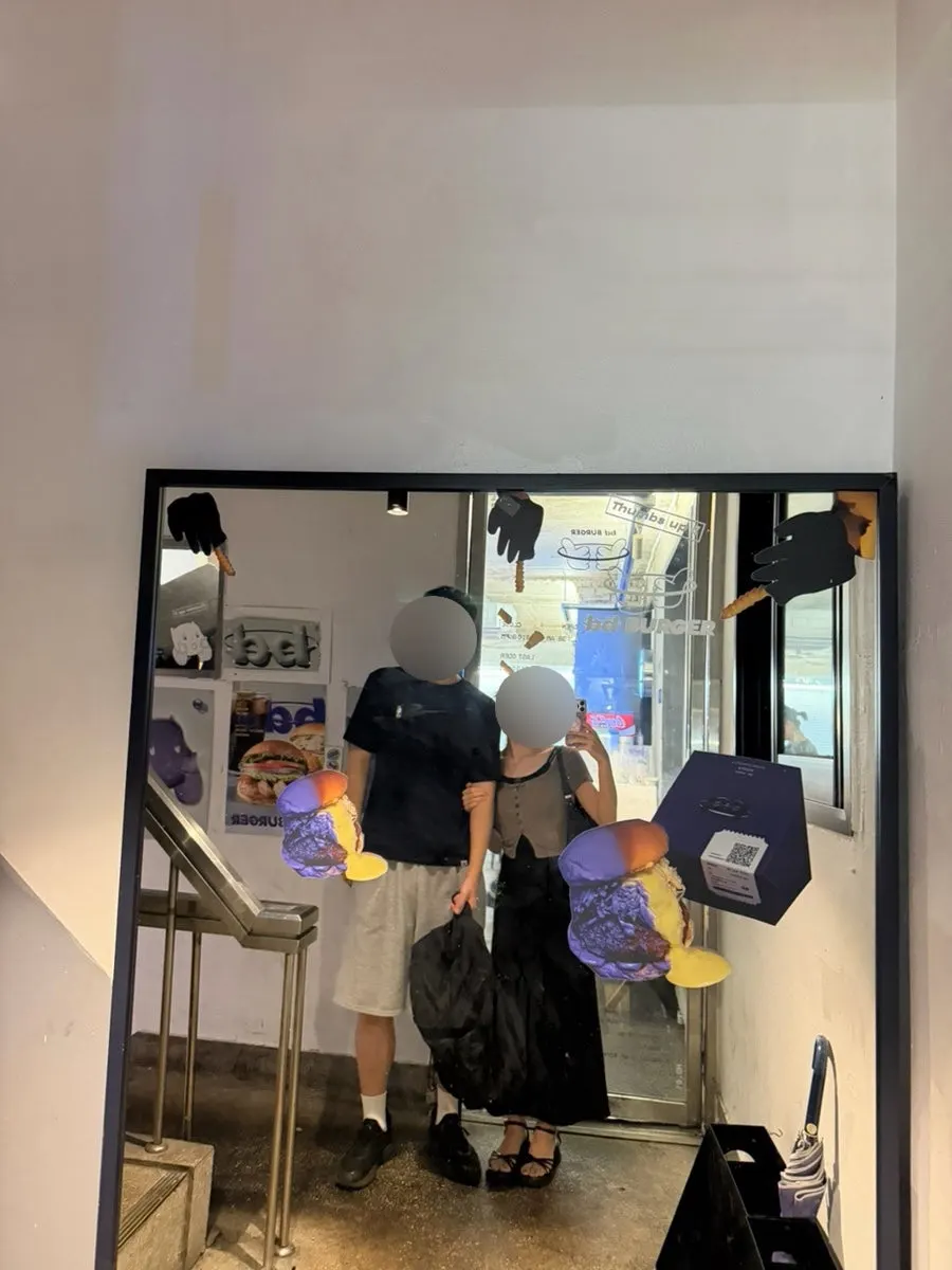 Full-length mirror photo zone downstairs from the shop