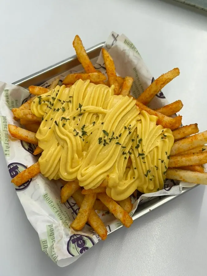 Butter Garlic Cheese Fries piled with sauce