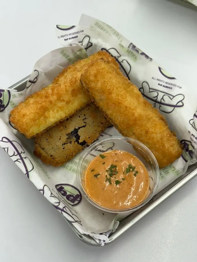 Close-up of fries coated in cheese sauce