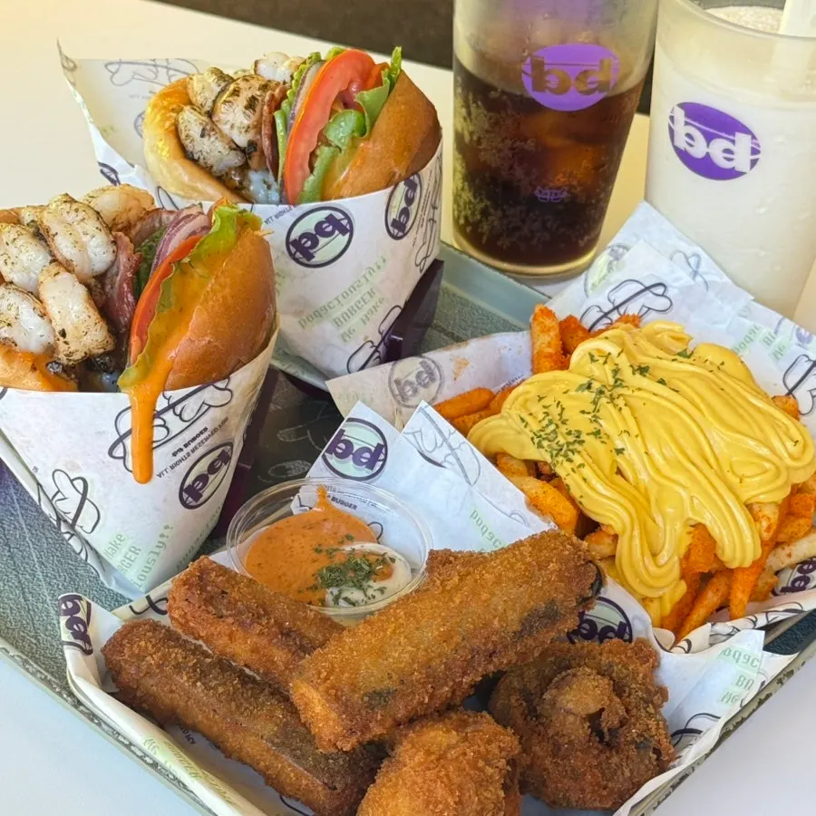 A generous spread of burgers and sides at bd Burger Seongsu