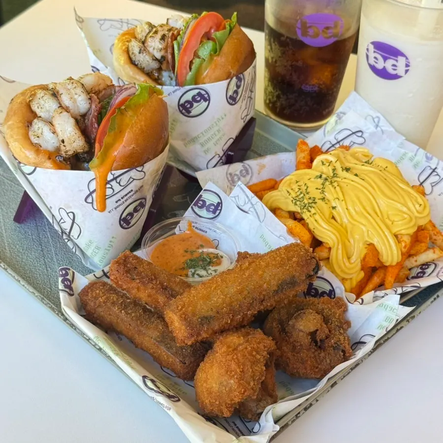 Full spread of burger sets and fried sides