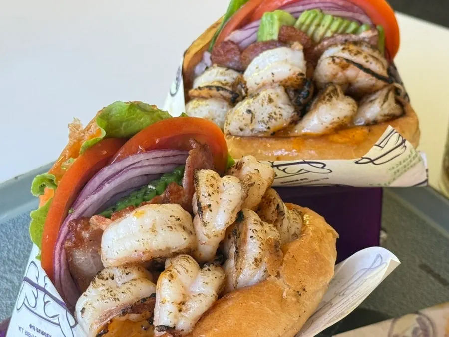 Grilled Shrimp Avocado burger topped with whole shrimp