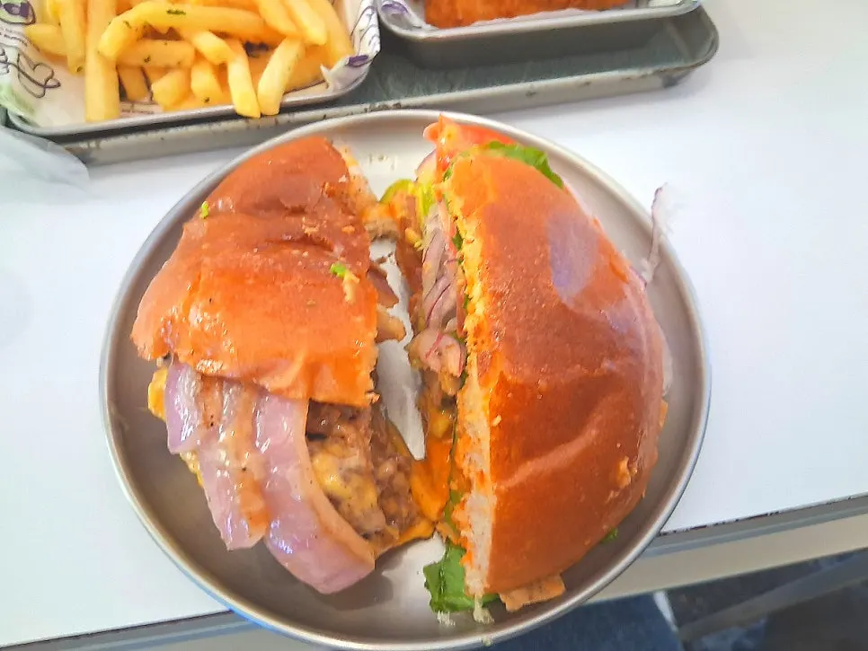 Cross-section of the double cheeseburger showing the thick patty