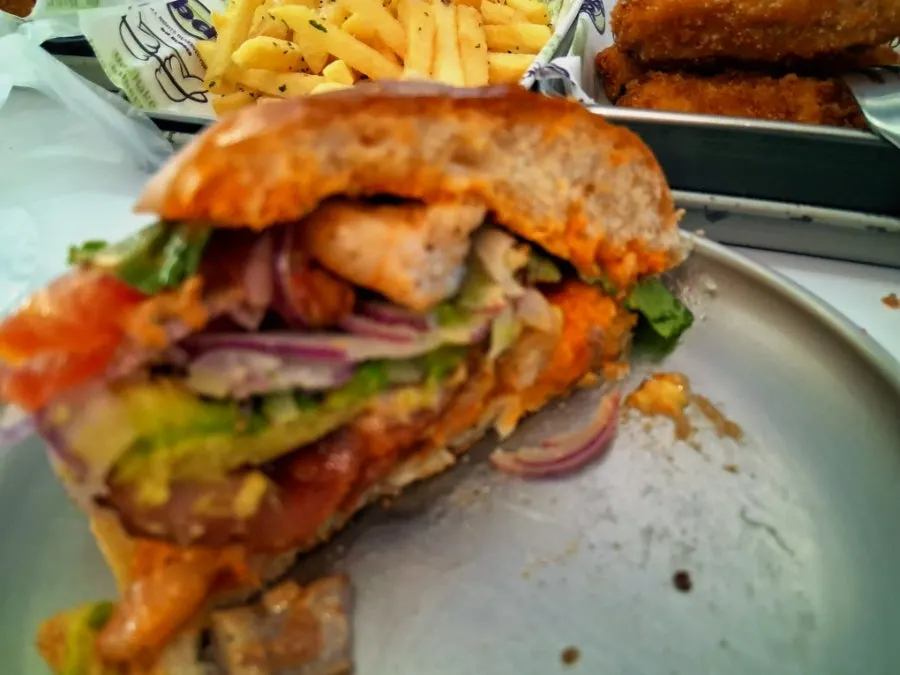 Burger filling showing whole shrimp and avocado