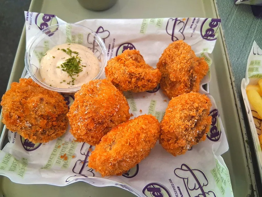 Eggplant fritters dipped in sauce
