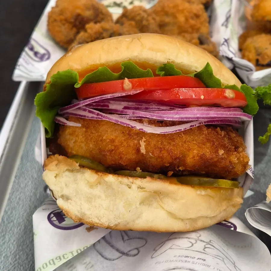 Sriracha shrimp burger with sriracha sauce and tomato