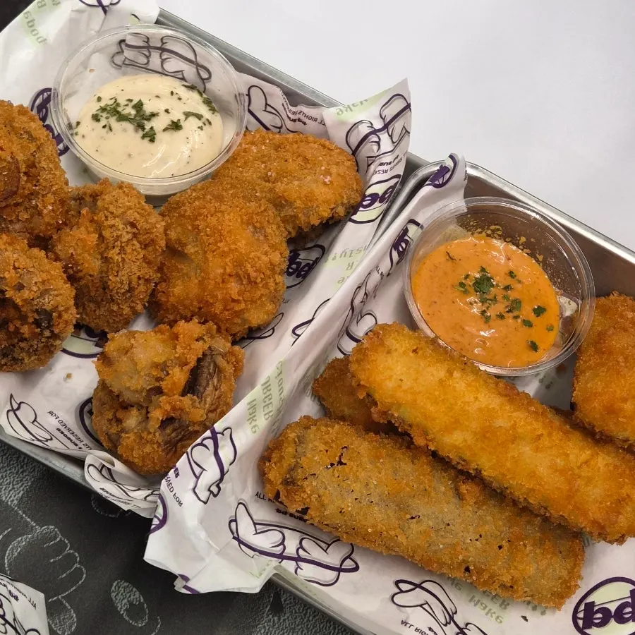 Eggplant fritters, mushroom fritters, and butter garlic fries side spread