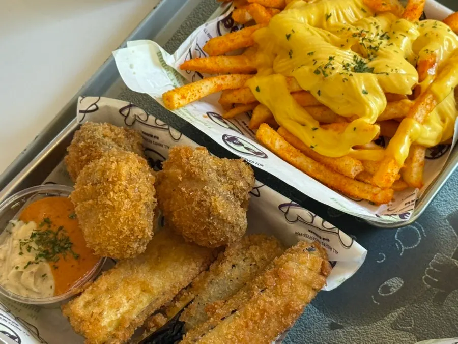 Freshly served handmade burgers with fried sides
