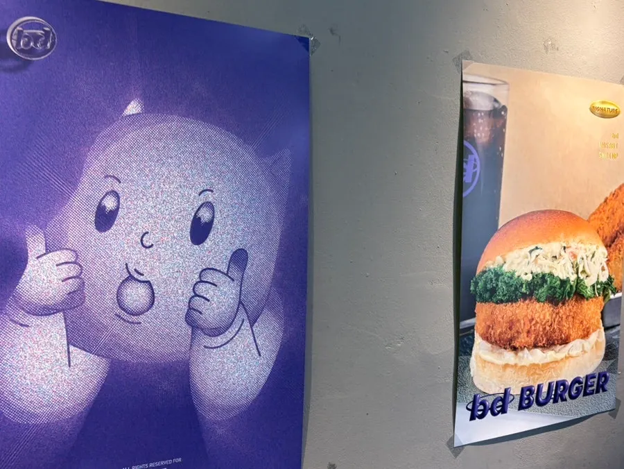 Menu sign highlighting the signature shrimp burger