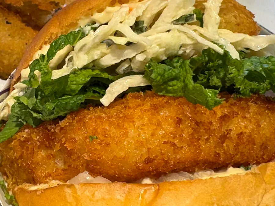 Cross-section of a bitten wasabi shrimp burger