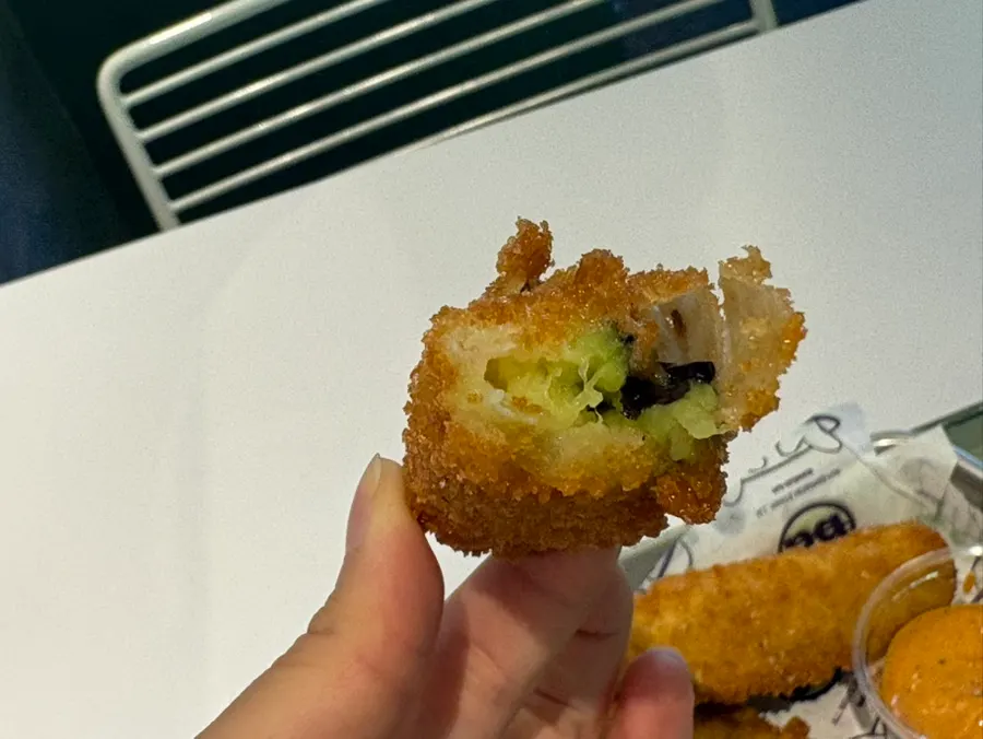 Four pieces of crispy-battered eggplant fritters