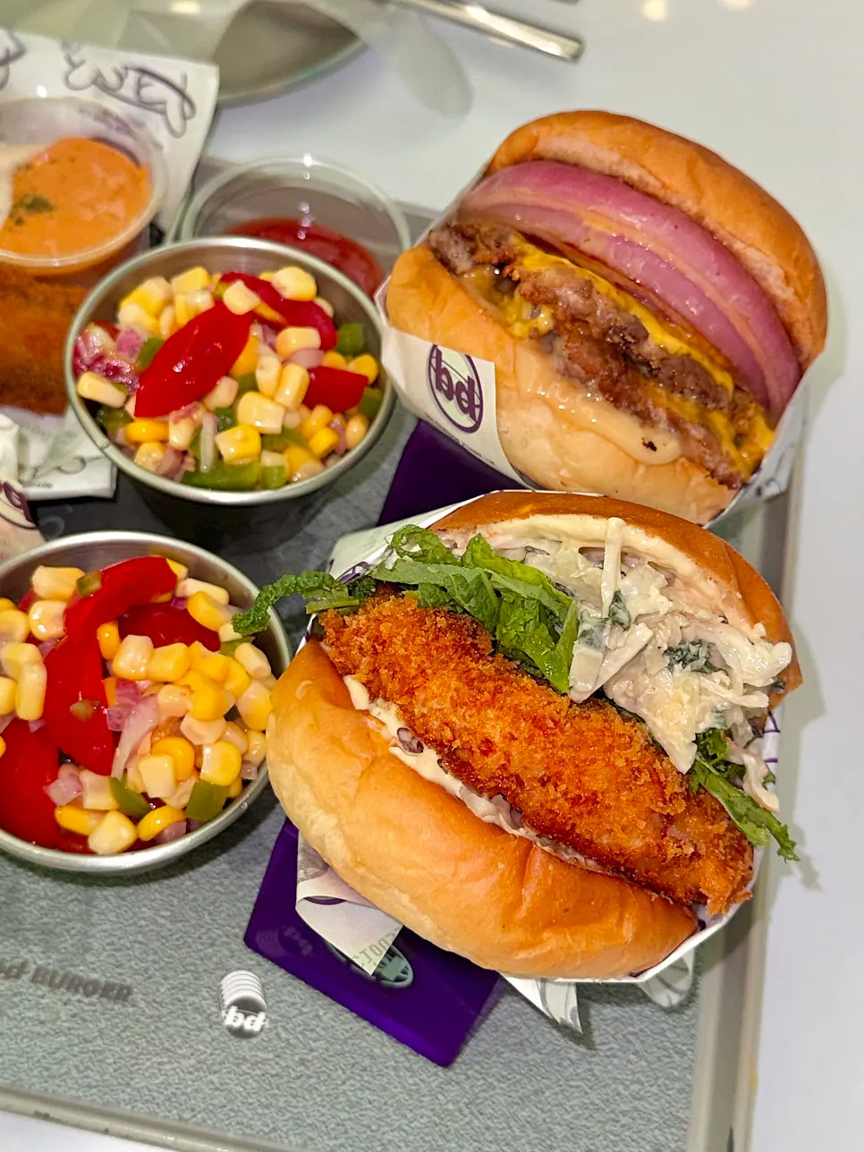 Two bd Burger lunch sets with corn salad