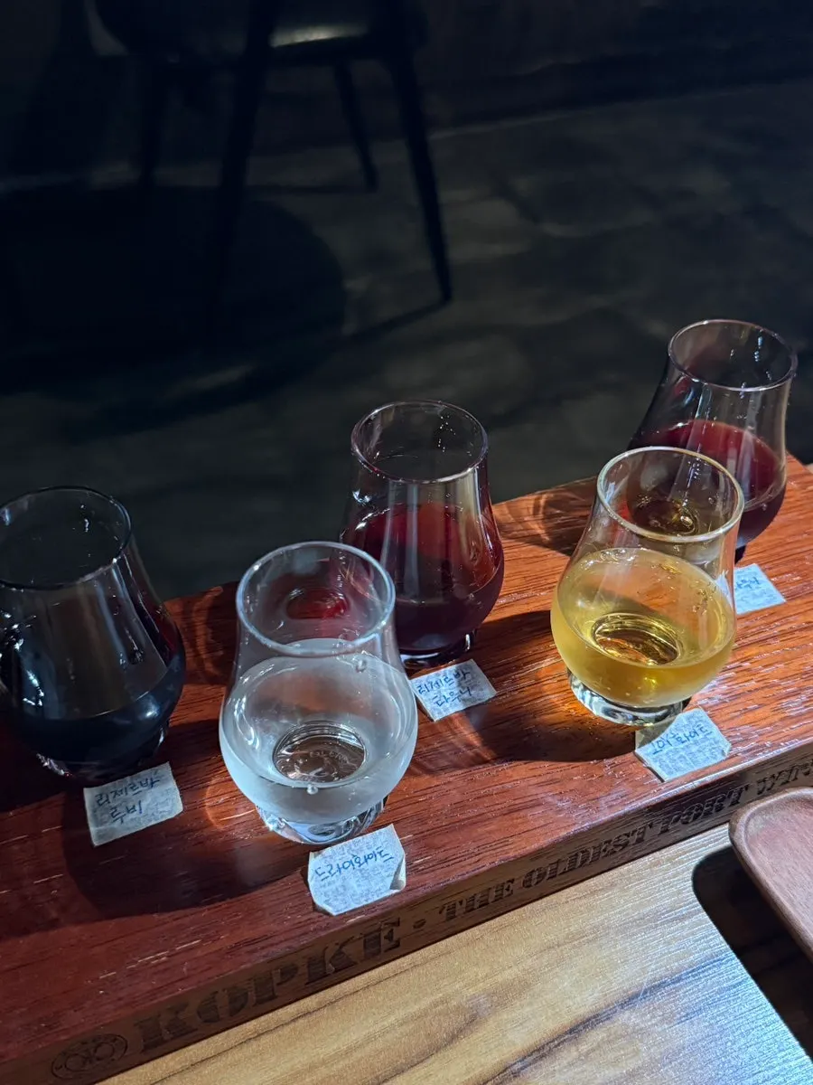 Five Cockburn's Reserva port wines on a wooden tray