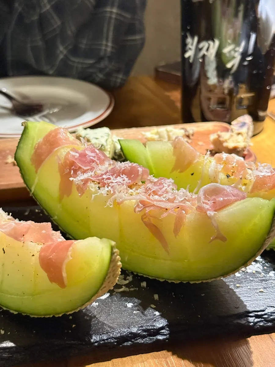 A plate of melon prosciutto