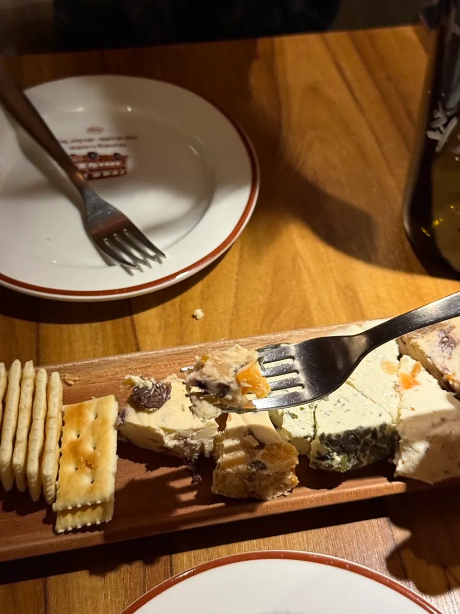 Cream cheese with visible dried blueberries and dried apricots