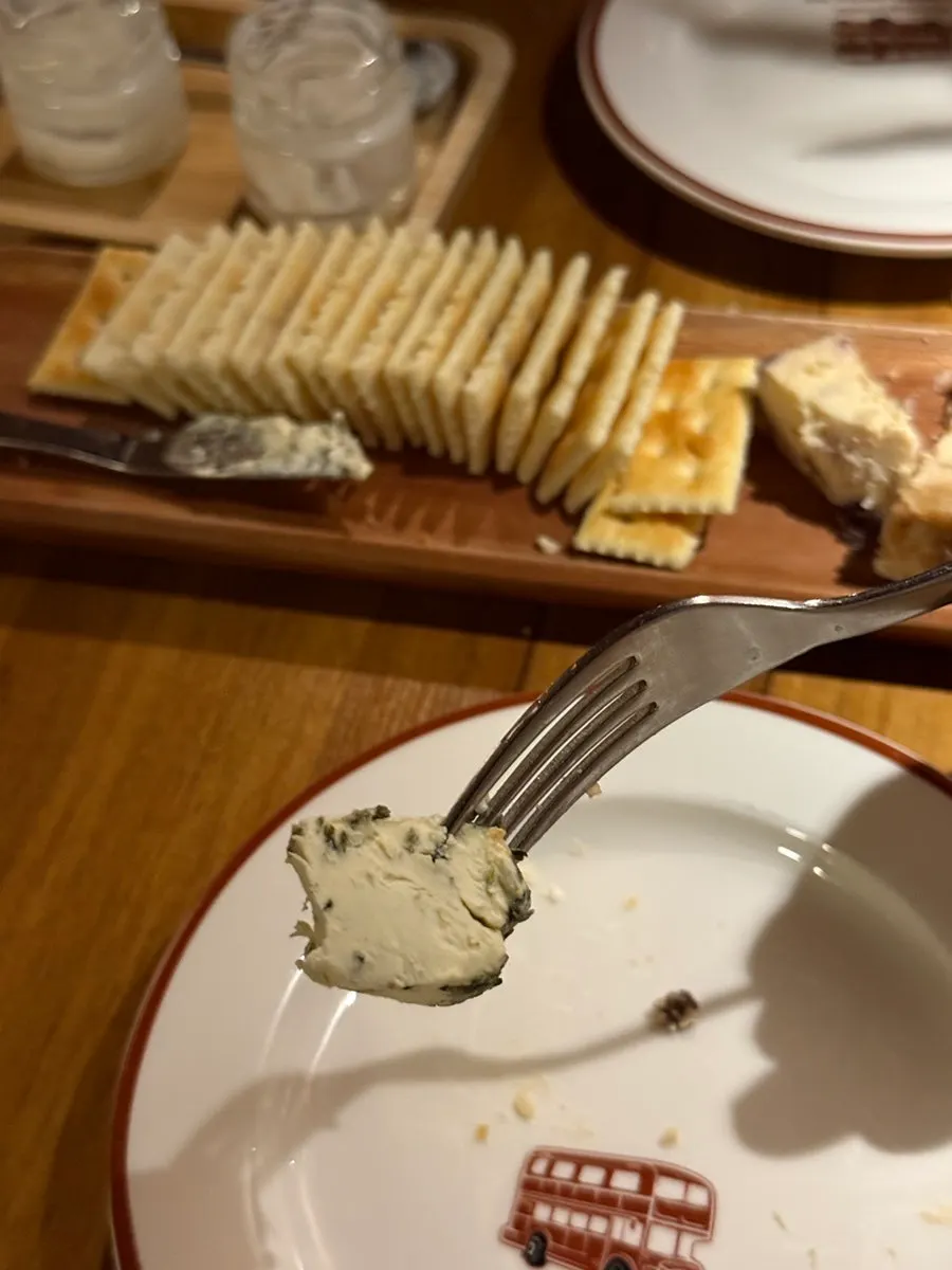 Fruit cream cheese piled on a cracker
