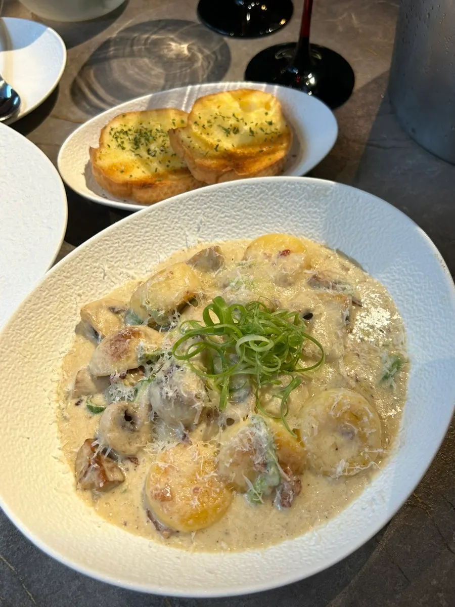 Vinf's green onion cream gnocchi topped with shredded green onion