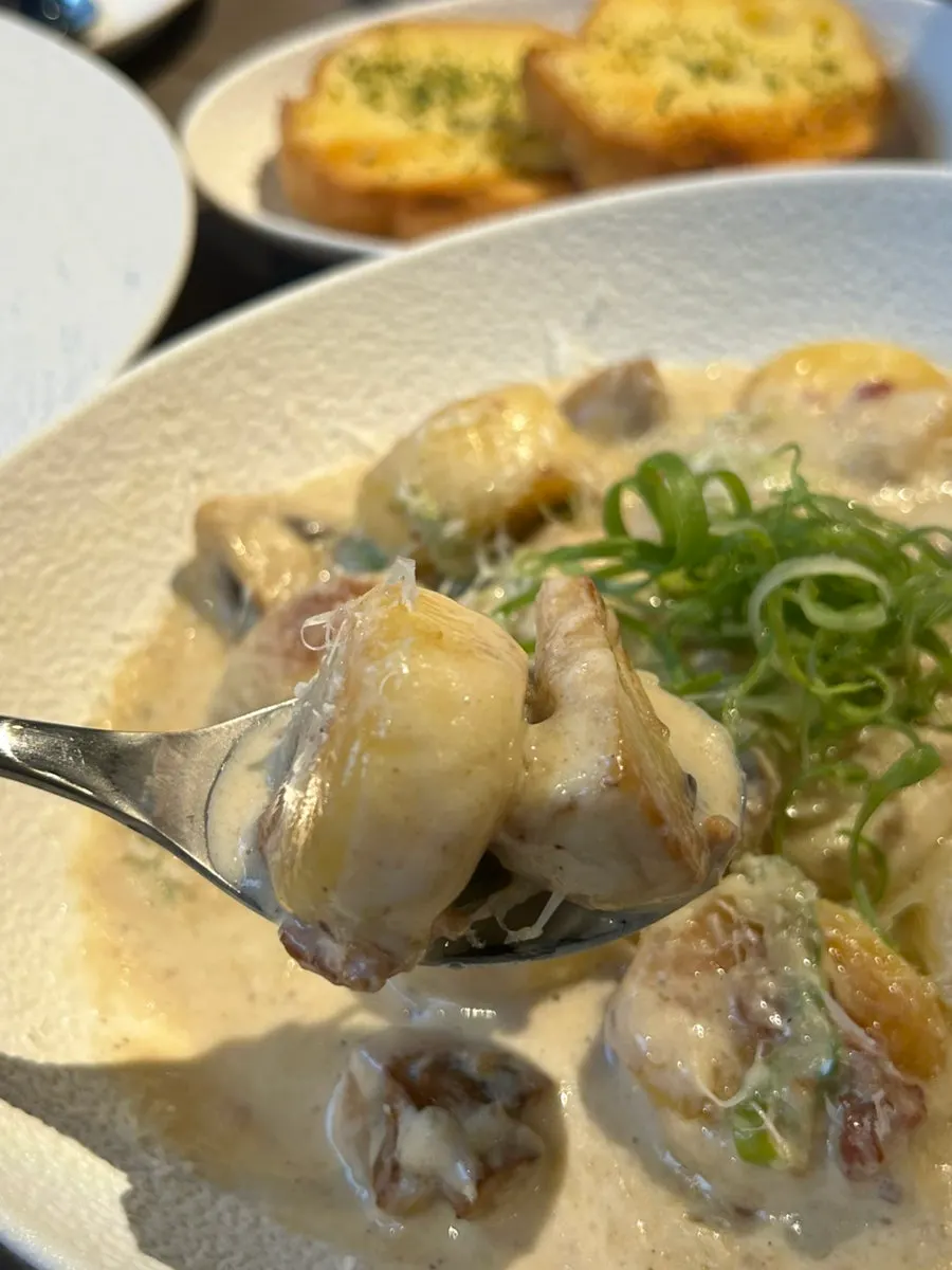 Close-up of gnocchi loaded with mushrooms