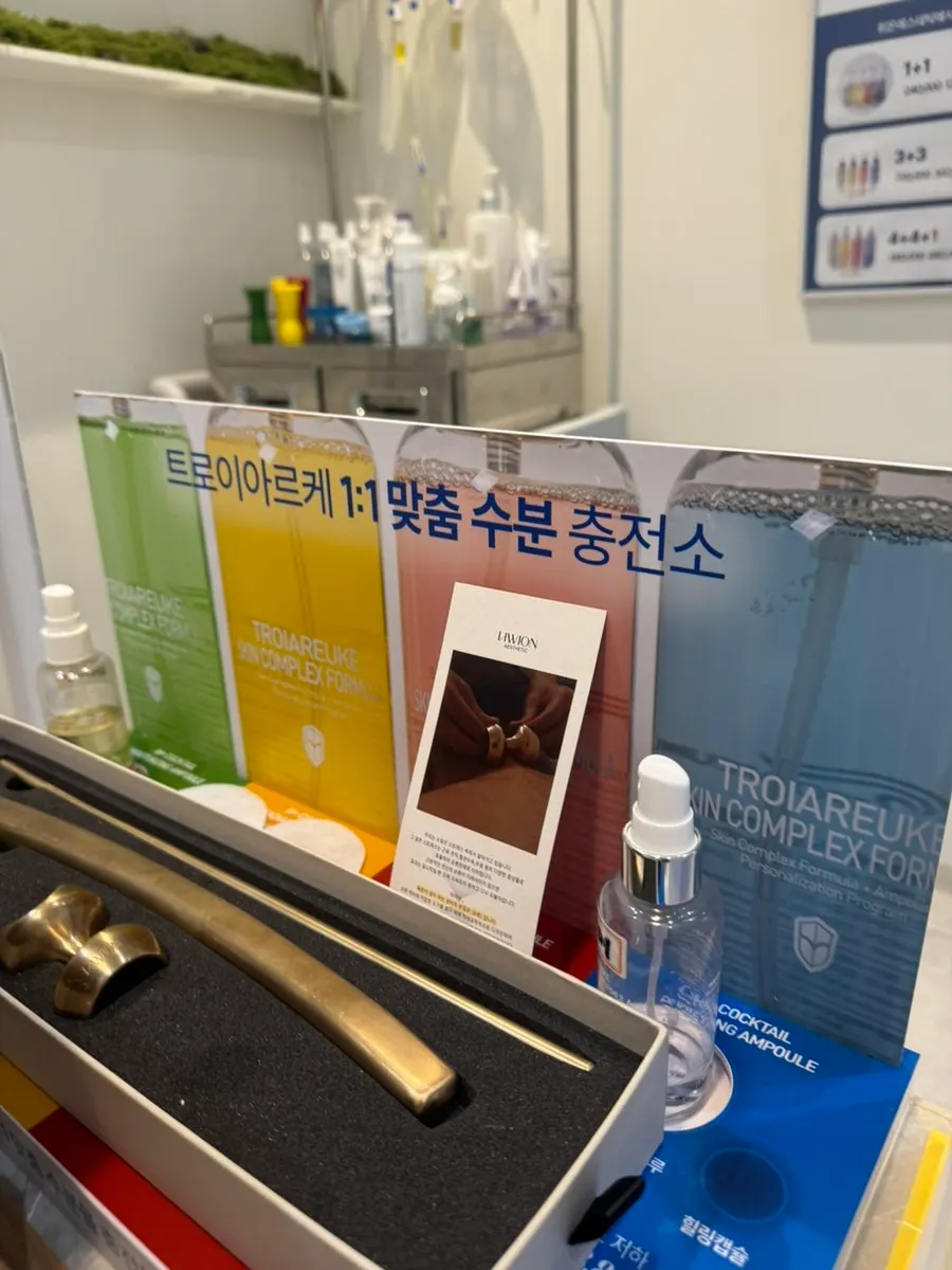 Signage for the 1:1 custom hydration station and displayed products