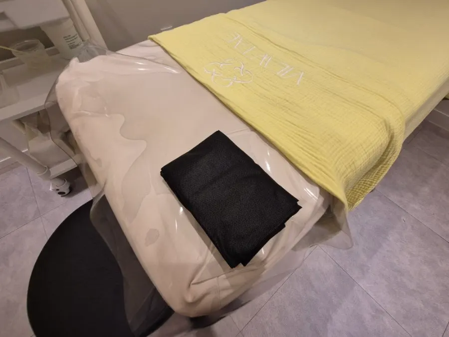 Disposable gown prepared in the treatment room