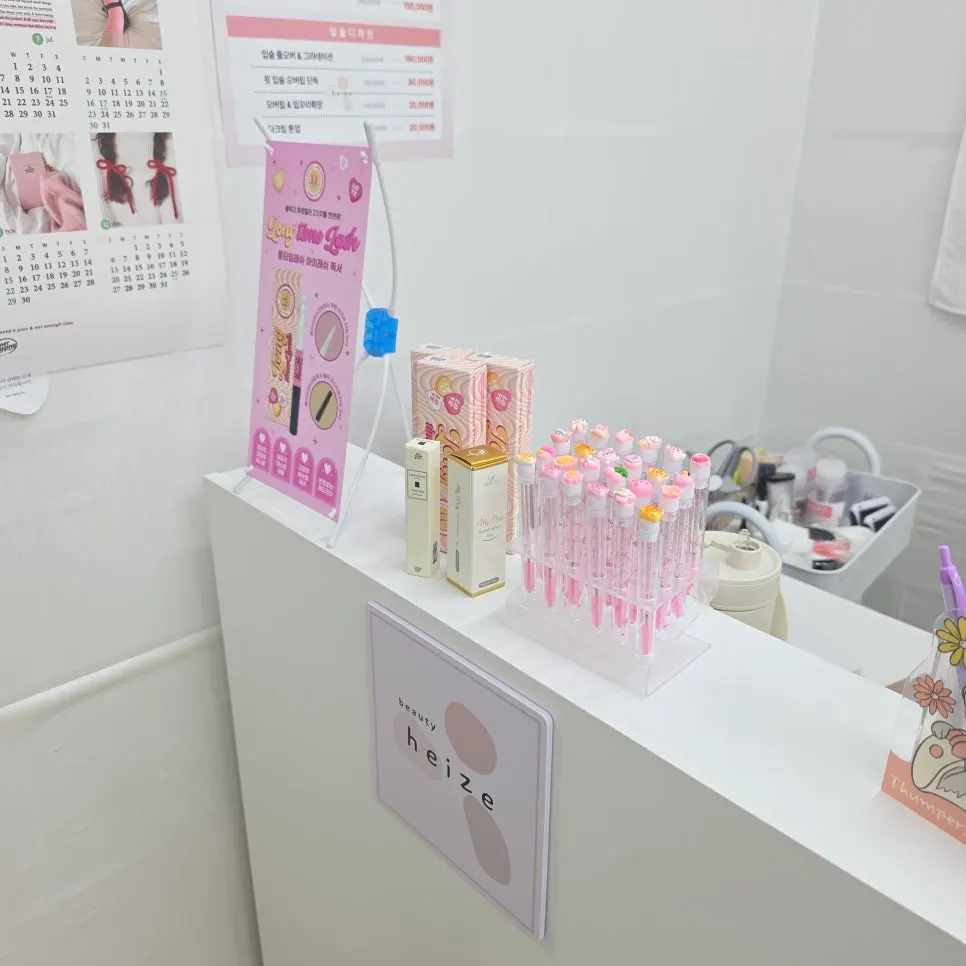 Lash nourishing serum and fixer products displayed by the checkout counter