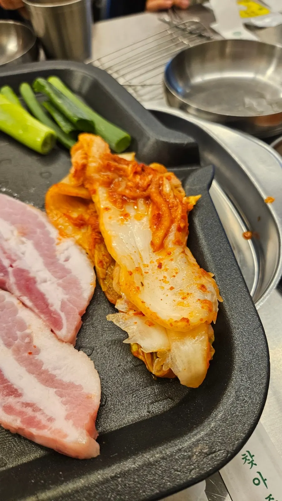 Bright red whole cabbage kimchi generously seasoned