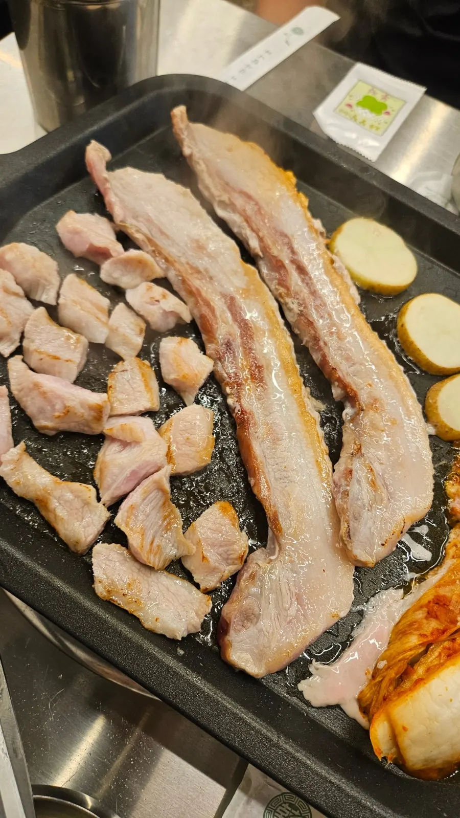 Pork belly and pork jowl arranged like flower petals on the meat cake