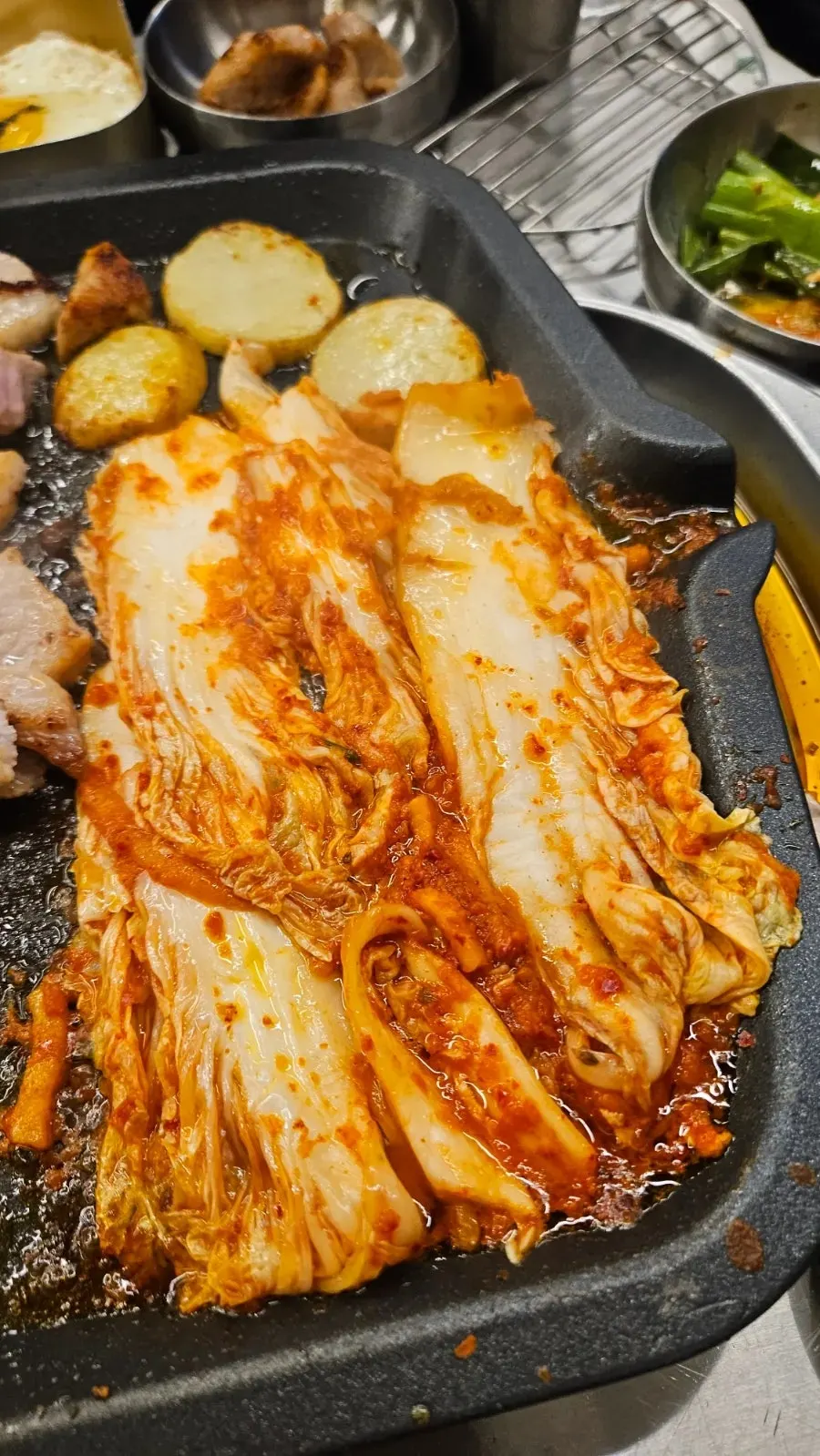 Pork belly and pork jowl placed on the grill