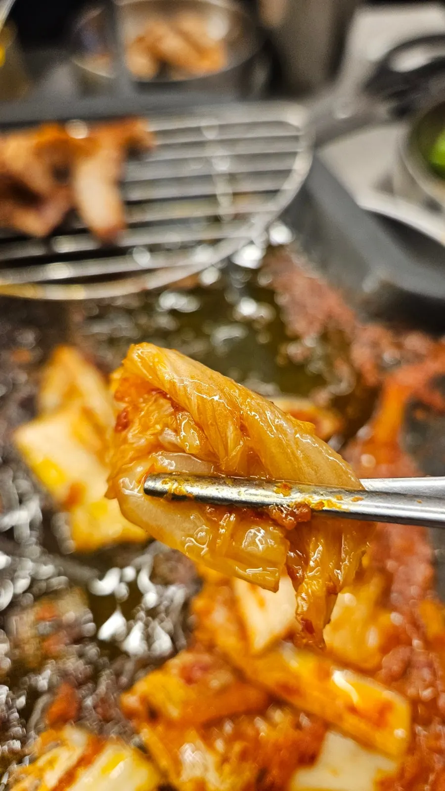 Grill with meat, potato, and green onion cooking together