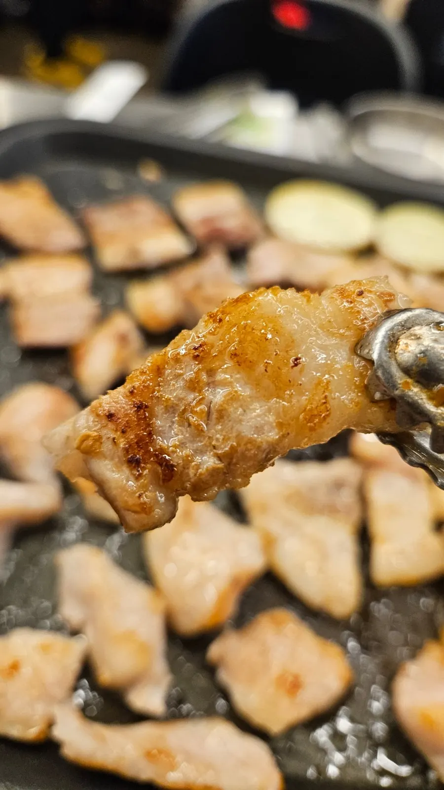 A piece of golden brown grilled pork belly