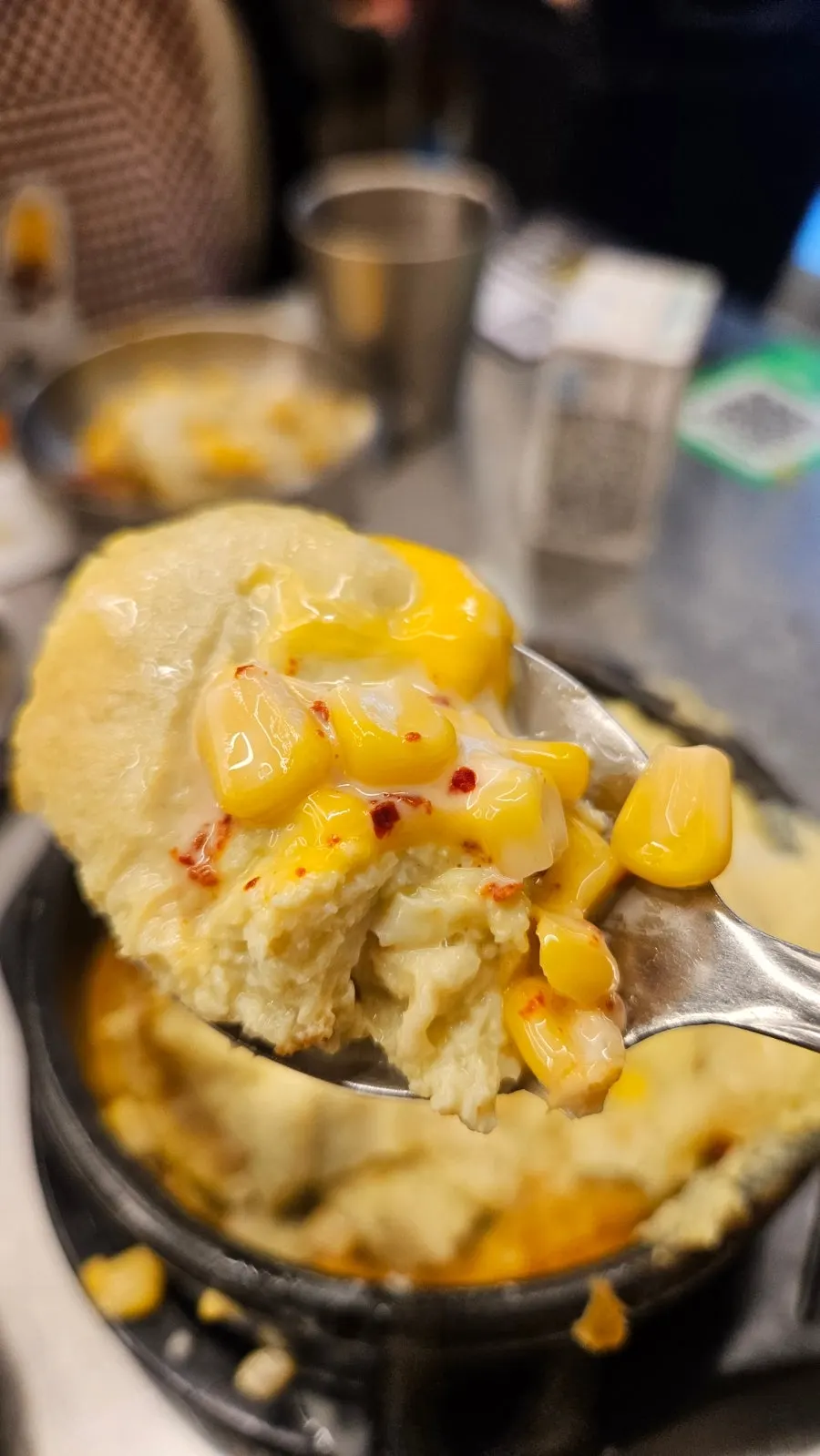 Cheese bomb egg custard rising out of the stone bowl