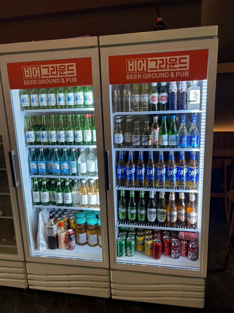 Display of bottled beers including Guinness and Blanc