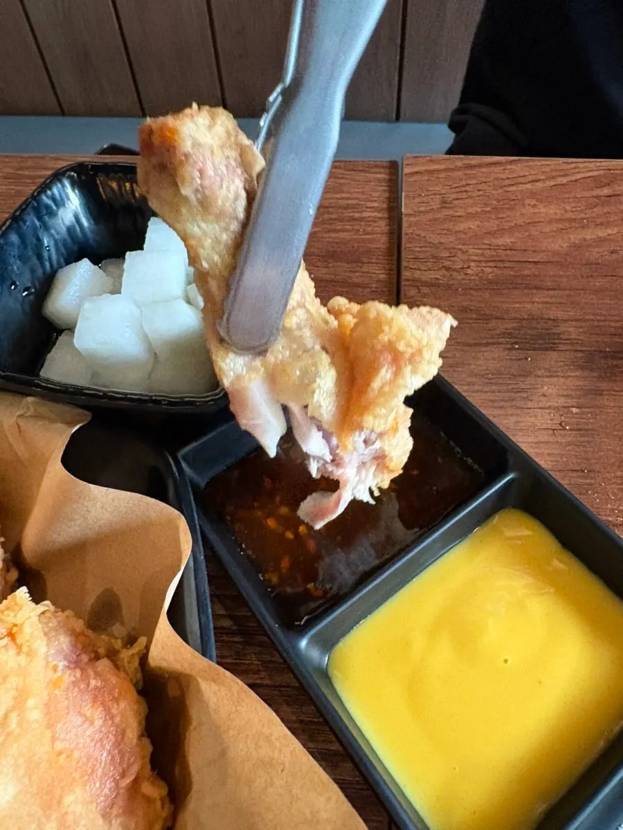 Handmade fried chicken with hearty drumsticks visible