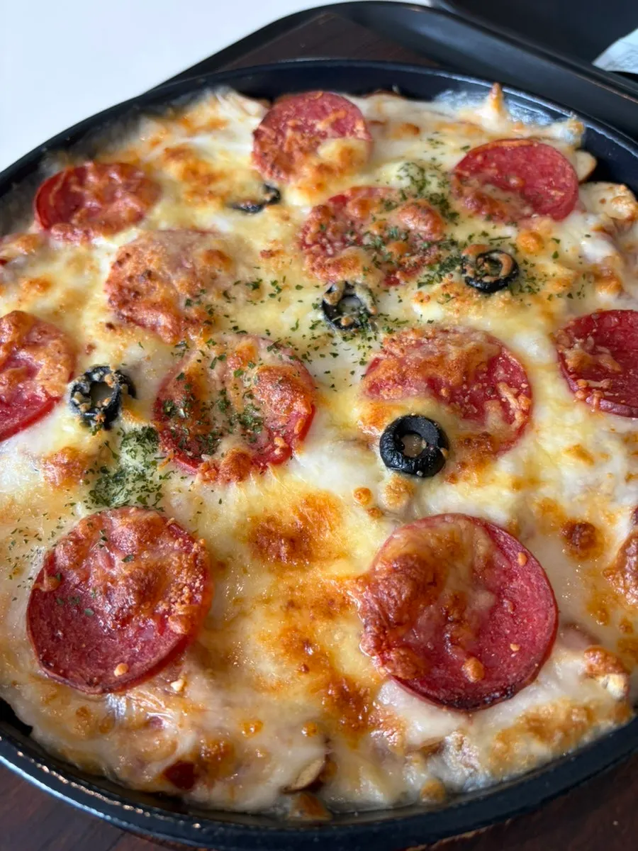 Close-up of the spoonable pizza with pretzel hidden inside