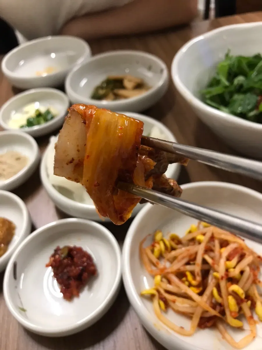 A piece of pork belly dipped in salt