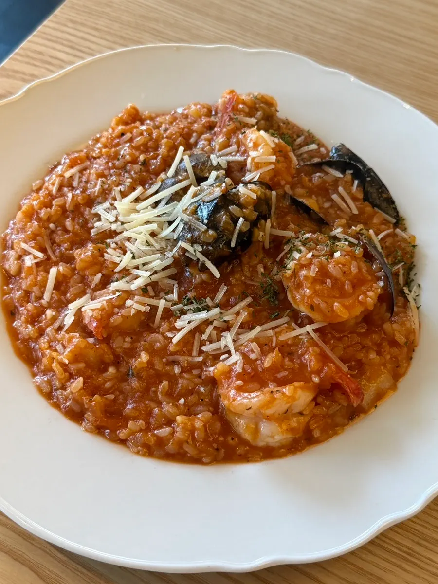 A plate of seafood tomato risotto
