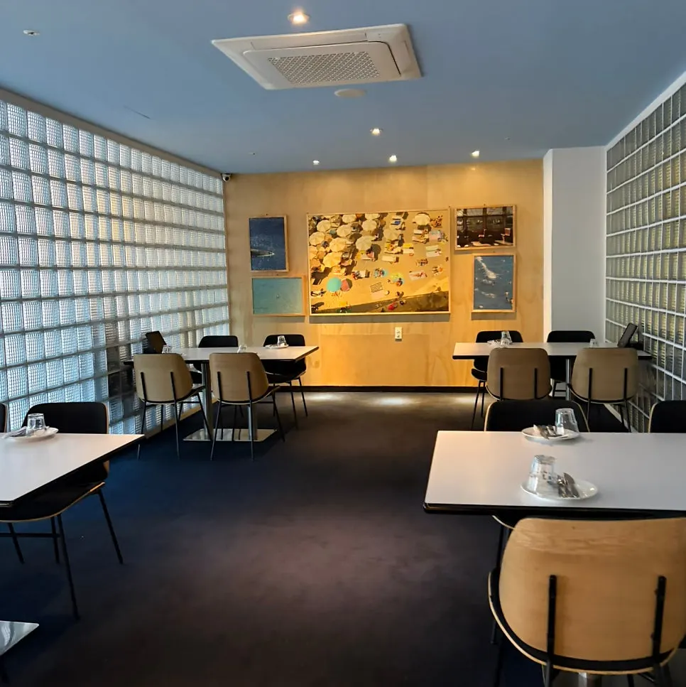 Interior space with framed artwork on display