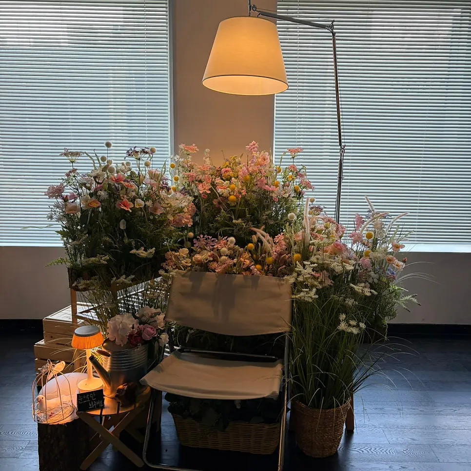 Photo zone decorated with flowers and props