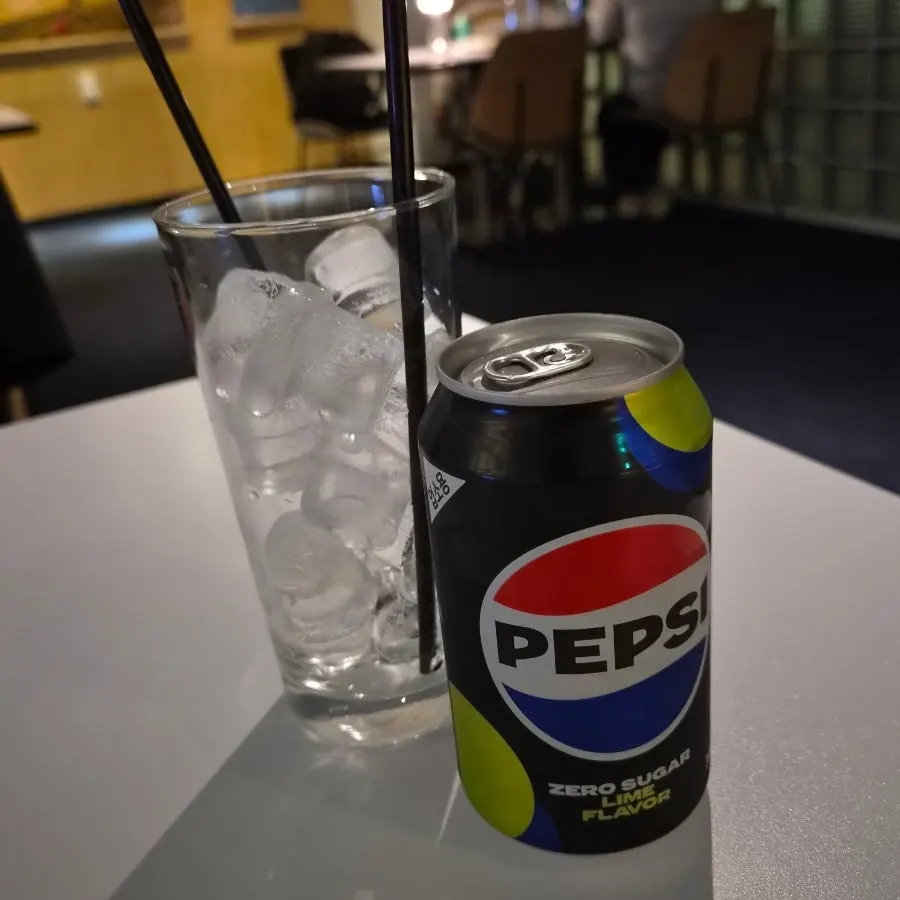 Cola served with a glass of ice