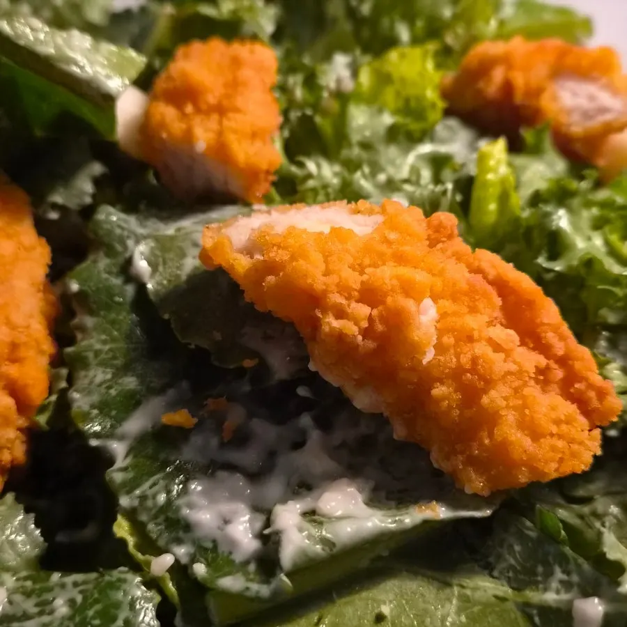 House-made Caesar dressing over romaine lettuce