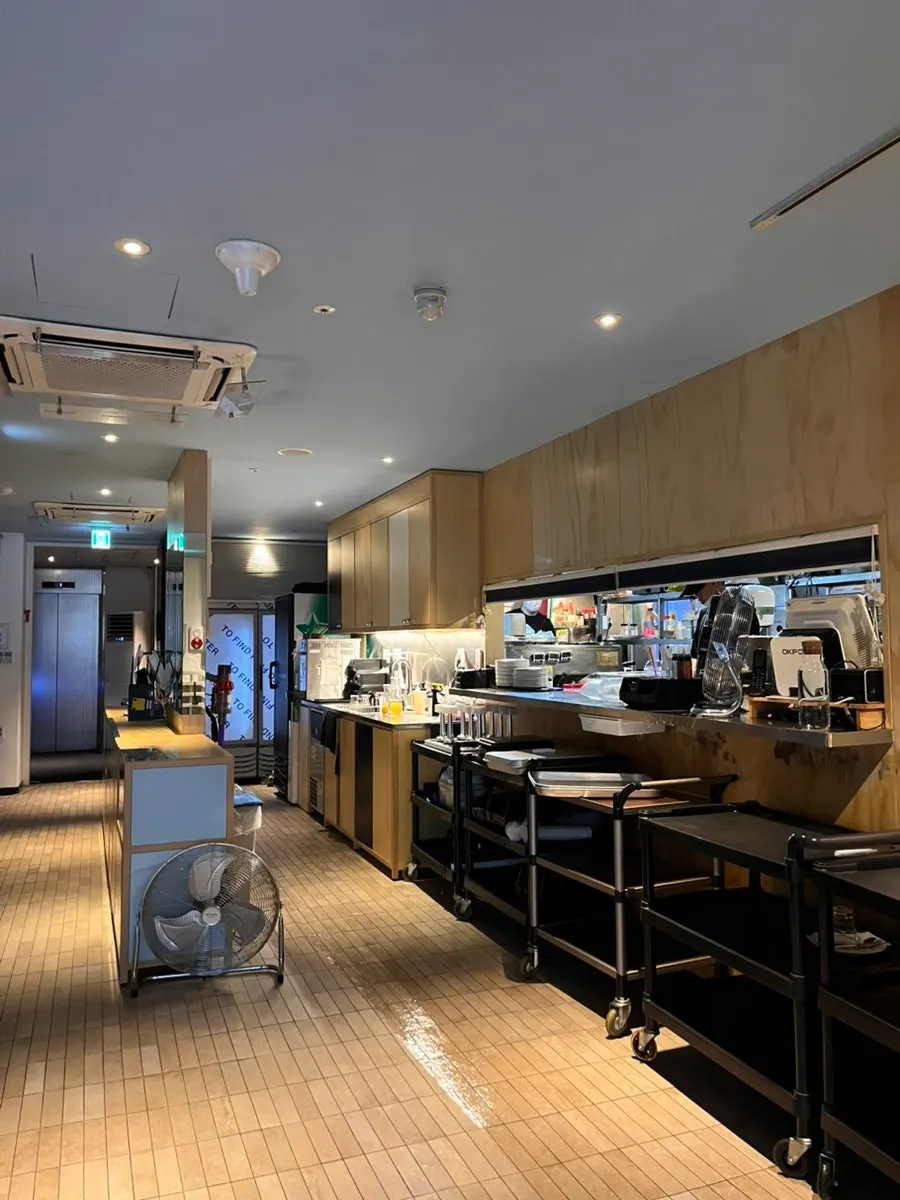 Open kitchen visible near the entrance of Two Find Peter Beomgye Branch