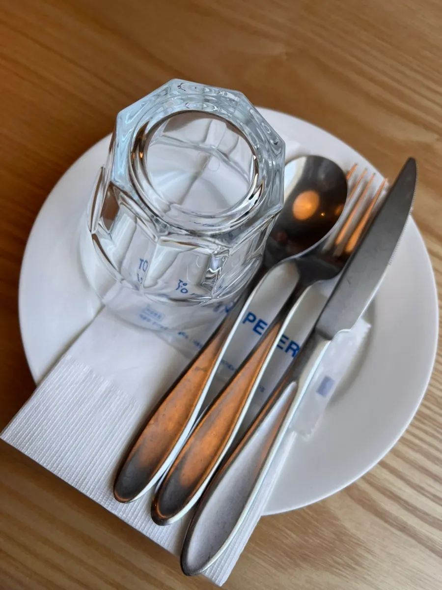Neatly arranged tableware set at the table